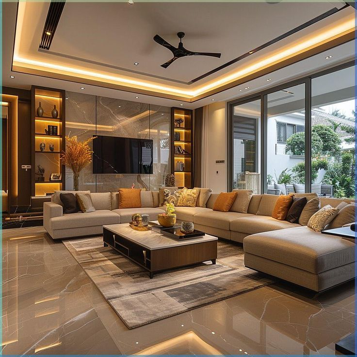 Modern luxury living room interior featuring a large beige sectional sofa, marble flooring, warm ambient LED lighting, built-in display shelves, a contemporary coffee table, and floor-to-ceiling glass doors opening to a landscaped outdoor space.